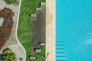 Outdoor Swimming Pool and Lawn Finishing Aerial View. photo