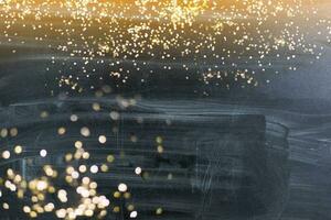 Golden bokeh lights with stone background photo