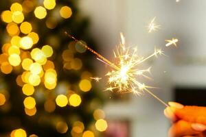 A lit sparkler showing bright sparks photo