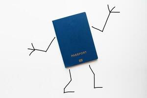Passport with painted hands and feet shows gesture ok photo