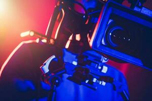 Camera Operator Behind Modern Digital Cinema Equipment photo