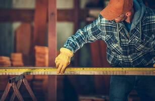 Worker Measuring Beam photo