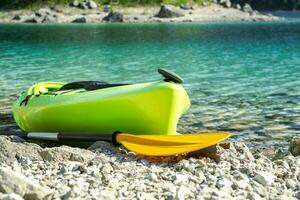 Touring Kayak on a Rocky Lake Shore photo