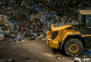 Handling Large Pile of Waste with a Bulldozer photo