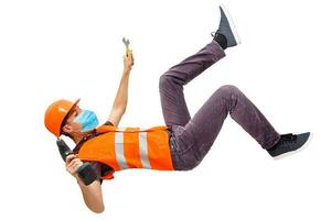 Worker in protective workwear with tools, isolated photo