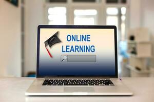Open laptop with screen with text ONLINE LEARNING photo