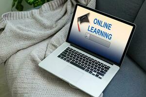 Open laptop with screen with text ONLINE LEARNING photo