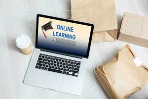 Open laptop with screen with text ONLINE LEARNING photo