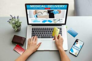 Online pharmacy. Application in your laptop for online ordering of medicines. laptop close-up. Lots of pills. photo