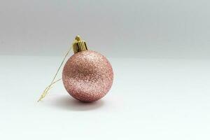 Single red Christmas tree ball decoration isolated over the white background, photo