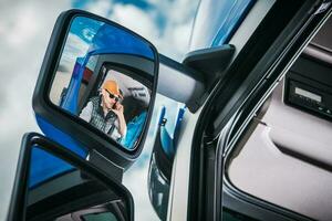 Truck Driver in the Mirror photo