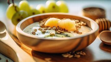 Mango yogurt with granola and kiwi in wooden bowl Illustration photo