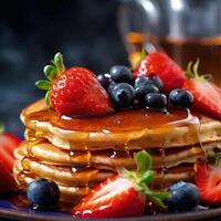 Delicious pancakes, with fresh blueberries, strawberries and maple syrup Illustration photo