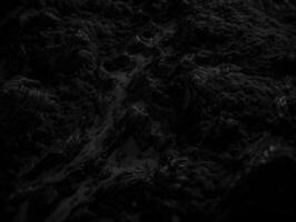 Black and white paper cut terrain background created with technology. photo
