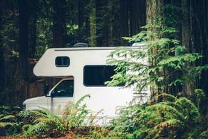 Class C Motorhome Camper RV in on a Camping photo