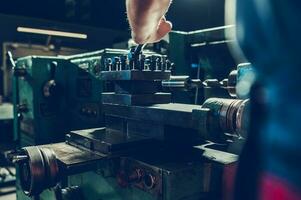 Lathe Machine Operated by Professional Machinist photo