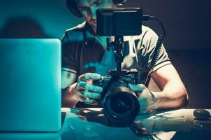 Camera Operator Reviewing Video Material on Display photo