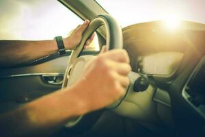 Hands on the Steering Wheel While Driving a Car photo