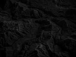 Black and white paper cut terrain background created with technology. photo