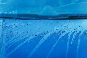 Wet Automobile Bonnet And Windshield. photo