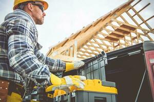 Construction Worker Preparing Himself For Another Day in Job photo