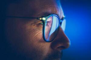 Focused Caucasian Entrepreneur in Glasses Close Up photo
