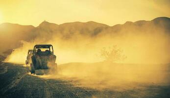 Side by Side ROV Recreational Off Highway Vehicles on a Desert Road photo