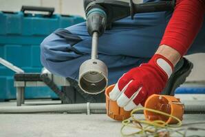 Electric Socket Box Drilling In Concrete House Walls photo