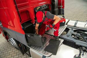 Truck Mechanic Preparing Tools to Start the Repair photo