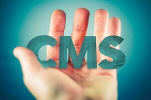 CMS in a Hand Concept photo