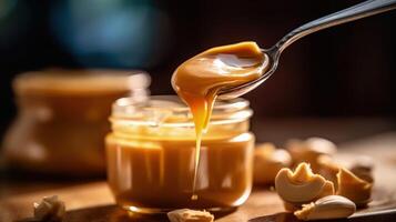 Spoon and glass jar with creamy peanut butter Illustration photo