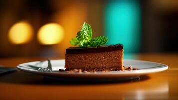 A piece of chocolate cake with mint. Illustration photo