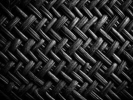 Dark black Abstract woven mat texture. Wickerwork background created with technology photo