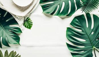 Top view of Tropical leaves on white wooden with white tablecloth background, photo