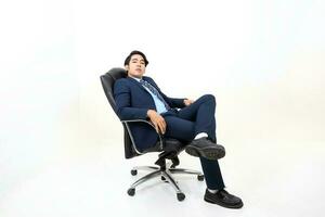 South east Asian Malay Man facial expression sit on chair confident photo