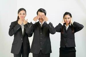 Young Asian male female wearing business office suit stand see no evil hear no evil speak no evil three wise monkey photo