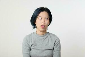 Young attractive Asian chinese malay woman pose face body expression mode emotion on white background yuk photo