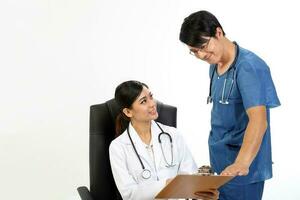 Young Asian male female doctor wearing apron uniform stethoscope sit on chair stand talk discuss photo