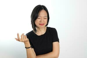 Young attractive south east asian woman pose face expression emotion on white background think hand gesture photo