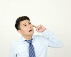 South east Asian chinese Man facial expression thinking finger on forehead photo