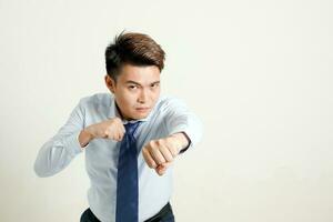 South east Asian chinese Man facial expression fist box punch photo