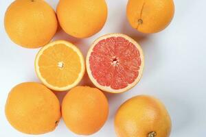 Orange grapefruit slice closeup on white background photo