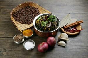 Bengali style black chickpeas chana sola lentil dal peas bhuna recipe onion garlic dry chili bay leaf cinnamon fumaric power cumin seeds salt photo