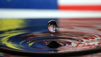 Water droplet drop splash collision dripping pillar Malaysia Flag reflection refraction independence country patriot photo