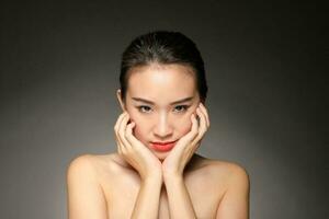 Young beautiful Asian woman facial expression photo