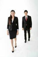 South east Asian young Chinese man woman wearing formal business office ware on white background walk forward confident following photo