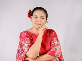 Elderly senior Asian woman posing facial expression photo