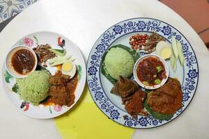 Coconut steam nasi lemak beef rendang chicken berampa fried set half boil egg petai sambal sauce peanut anchovy photo