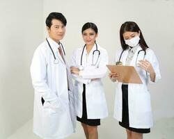 Young Asian male female doctor wearing apron uniform tunic apron hold photo