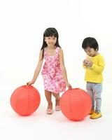 South East Asian young father mother daughter son parent boy girl child activity indoor photo